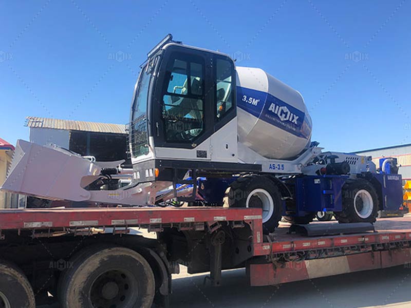 Self-loading concrete mixer truck on a trip